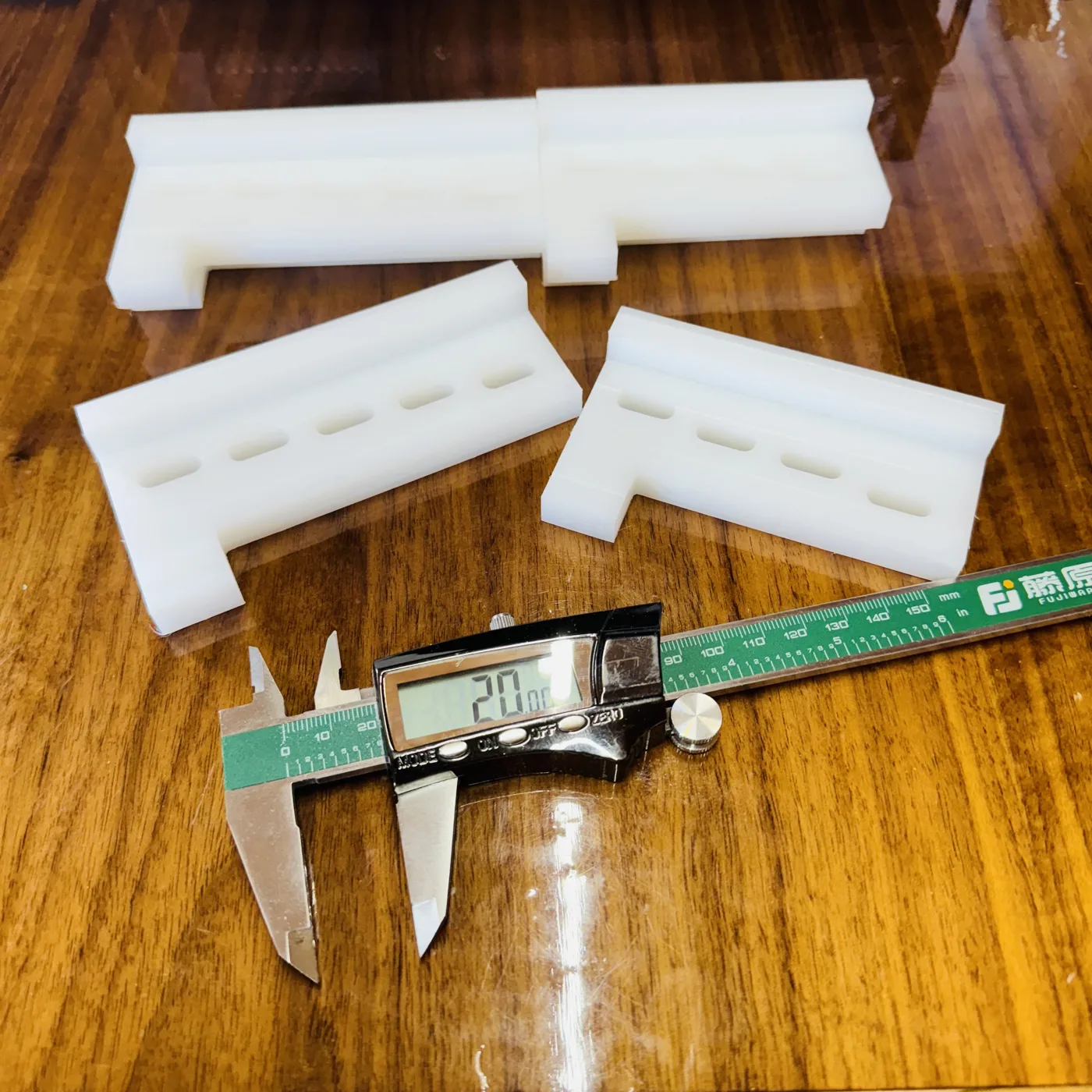 Machined plastic components — Slotted and profiled parts made to suit a custom application.