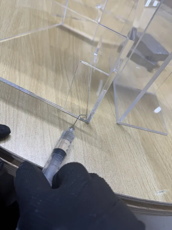 Close-up of a clear acrylic assembly and its joined panels