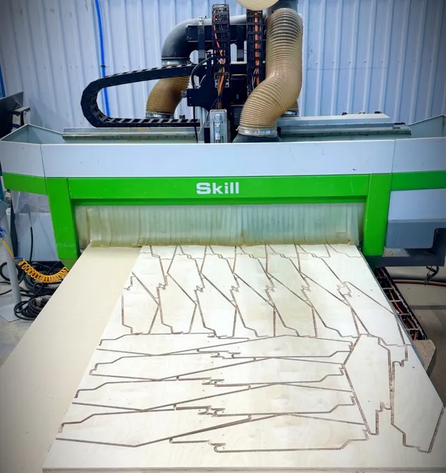 Biesse CNC router cutting nested shaped wood components