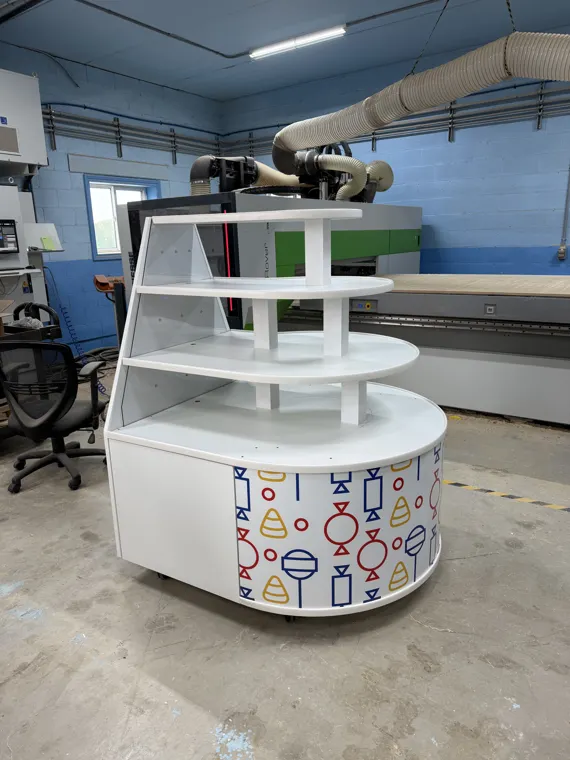 Round multi-level display fixture inside the workshop