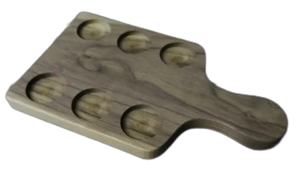 Shaped wooden serving board with circular recesses